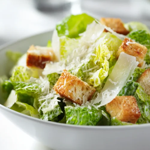 Caesar salad with romaine lettuce, parmesan shavings, and crispy croutons.